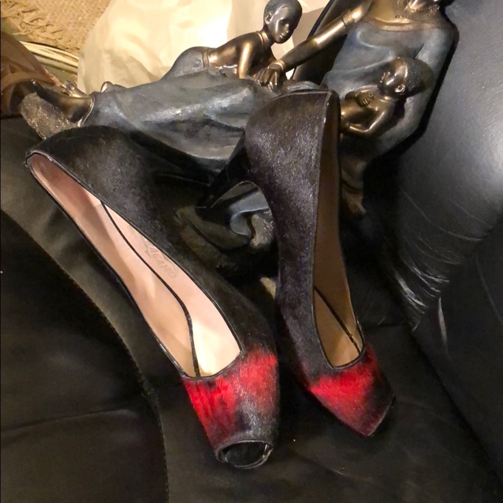 Bold, beautiful a knockout wearing black and red Ferragamo!